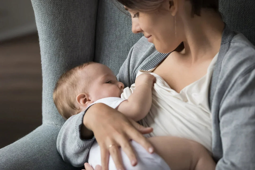 Parent continuing to breastfeed an older baby after starting solids