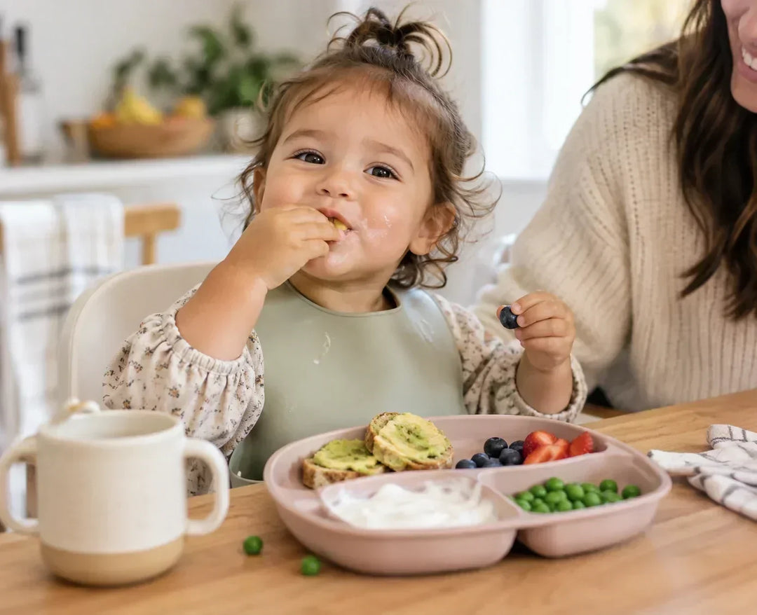 Toddler eating fiber-rich foods that support digestion and gut health